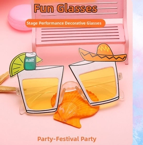 Funny cocktail glass party sunglasses with lime and sombrero detail on a pink background
