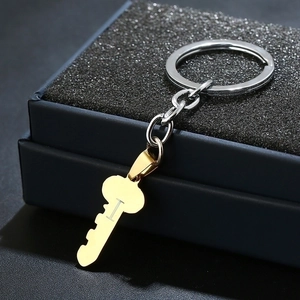 Golden heart key keychain with I Love You engraving on a dark gift box