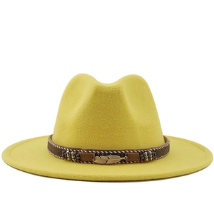 Vibrant yellow wool fedora hat with wide brim and decorative gold feather band