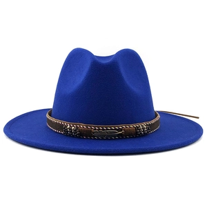 Detail of navy wool fedora with brown braided band and antique bronze feather pendant