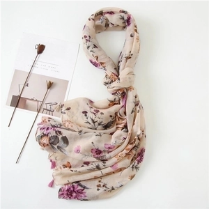 Elegant floral print shawl for women with fringe tassels and soft pink botanical patterns