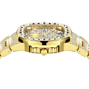 Macro side view of gold hip hop watch showing luxury diamond-studded bezel and strap