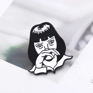 Enamel brooch pin featuring Mia Wallace character from Pulp Fiction on book background
