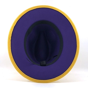 Detail of the inner purple fabric and yellow brim stitching of the bicolor fedora hat