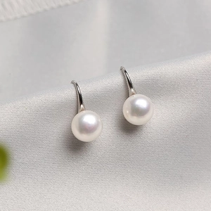 Elegant freshwater white pearl earrings with sterling silver high-heel style hooks