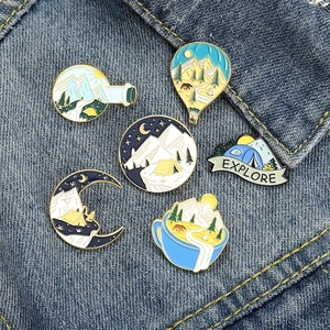 Outdoor camping enamel pin set with mountain, tent and hot air balloon on denim fabric