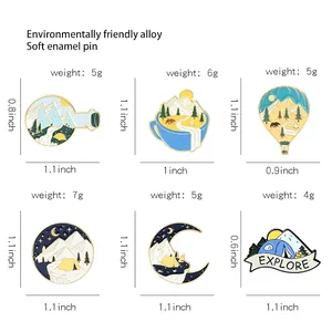 Enamel pins set featuring mountain, hot air balloon, and explore forest designs