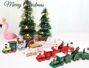 Detailed view of colorful wooden Christmas train figurines with snowman and bear characters