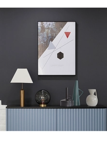 Close-up of ceramic vases and glass sphere lamp on a blue console table setup