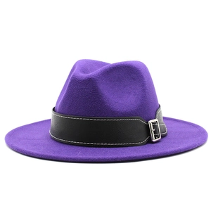Detail of purple wool fedora hat featuring a black leather band and silver square buckle