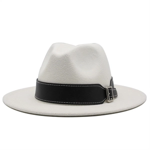 Close-up of white wool fedora hat featuring a black leather band with silver buckle