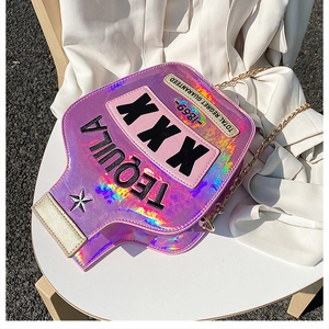 Detail of holographic tequila bottle bag with black embroidery and gold chain strap