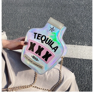 Detail of laser reflective bottle-shaped shoulder bag with Tequila XXX embroidery