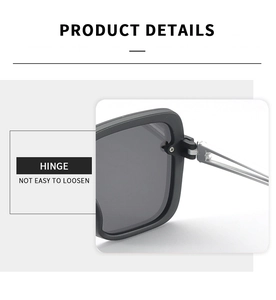 Detailed macro view of the durable metal hinge design on black square sunglasses