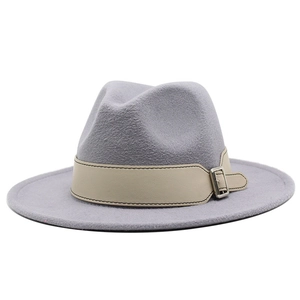 Detailed view of gray wool fedora hat with beige leather band and silver metal buckle