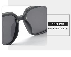 Close-up of lightweight integrated nose pads on black square fashion sunglasses