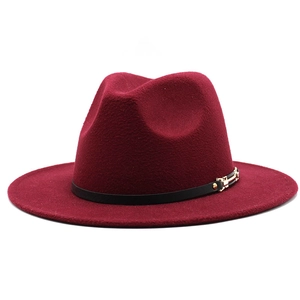 Elegant wine red wool fedora hat with black leather belt and gold buckle on white background