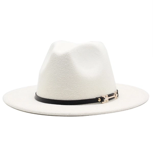 Detailed close-up of a white wool fedora hat with black leather band and gold metal buckle
