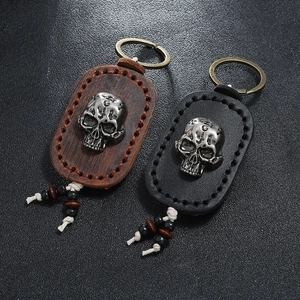 Gothic leather keychains with metallic skull badges and vintage beads decoration