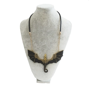 Gothic dragon pendant necklace in antique gold and black on a black cord strap