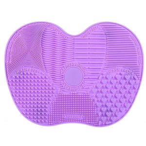 Purple heart-shaped silicone makeup brush cleaning mat with suction cups and textures