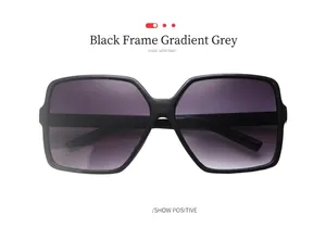 Front view of oversized fashion sunglasses with black frames and gradient grey lenses
