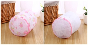 Detail of mesh laundry bags with pink zippers and floral pattern for washing machines
