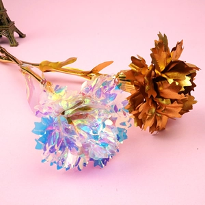 Close-up of holographic and gold foil carnations with pink background and tower model