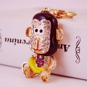 Porte-clés singe doré avec cristaux scintillants et petit pendentif banane mignon