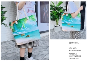 Detailed views of a large linen beach tote with tropical palm tree print and rope handles