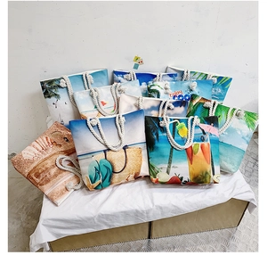 Detail of beach canvas tote bags with summer prints and thick cotton rope handles