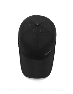 Detail of black breathable baseball cap featuring laser-cut perforations and sport logo