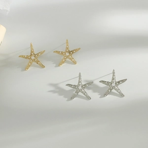 Elegant gold and silver starfish stud earrings with micro pearls and matte texture