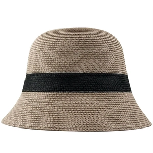 Minimalist straw bucket hat in khaki with a black ribbon band on a white background