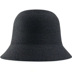 Detailed close-up of the tightly woven black straw texture on this stylish cloche hat