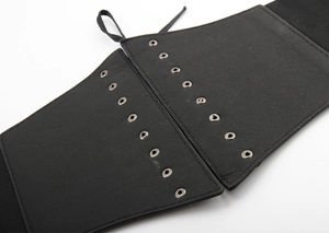 Detailed view of black elastic waist corset with metal eyelets and adjustable lace-up front