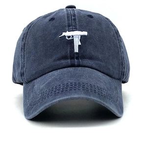 Navy blue washed cotton baseball cap featuring white Uzi submachine gun embroidery