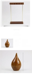Close-up of a 14.5cm teardrop-shaped resin stand and wooden jewelry display rod