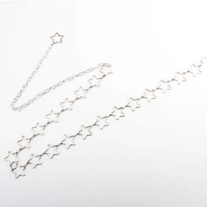 Elegant silver star chain waist belt for women with hollow stars on white background