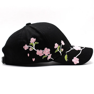 Black cotton baseball cap with pink cherry blossom embroidery and adjustable metal buckle