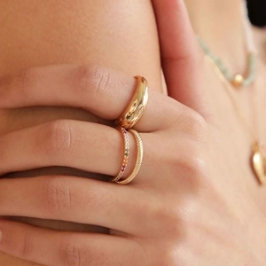 Gold star and eye engraved chunky ring set with colorful zircon stones on model hand