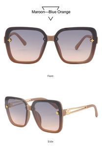 Macro detail of square sunglasses with gold clover motifs and woven metal temple design