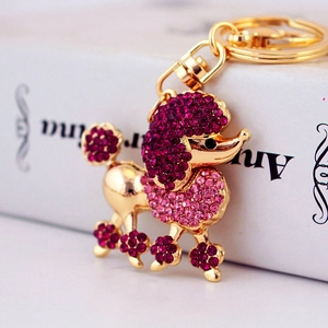Cute pink crystal poodle keychain with golden metal base and sparkling rhinestones