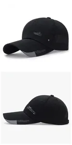 Detail of black sports baseball cap with breathable vents and white embroidered typography
