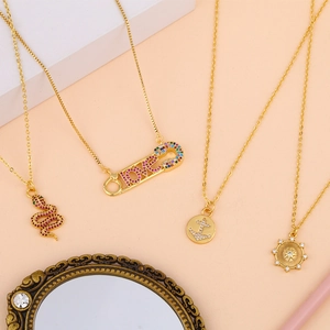 Gold snake pendant and LOVE safety pin necklace set with zircon accents for women