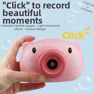Close-up of pink pig bubble machine camera with light, sound effects and easy one-button start