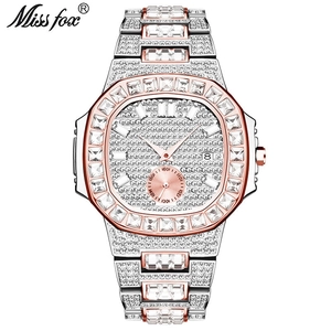 Detail of silver and rose gold bicolor watch with date display and iced out diamond bezel