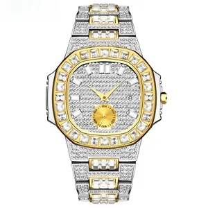 Macro view of iced-out gold and silver tone octagonal bezel watch with fine crystals