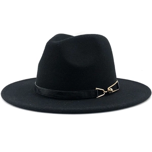 Detail of black fedora hat with elegant leather band and gold geometric buckle accent