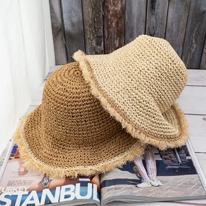 Handmade crochet straw hats with fringed edges in beige and khaki for summer beach vacations